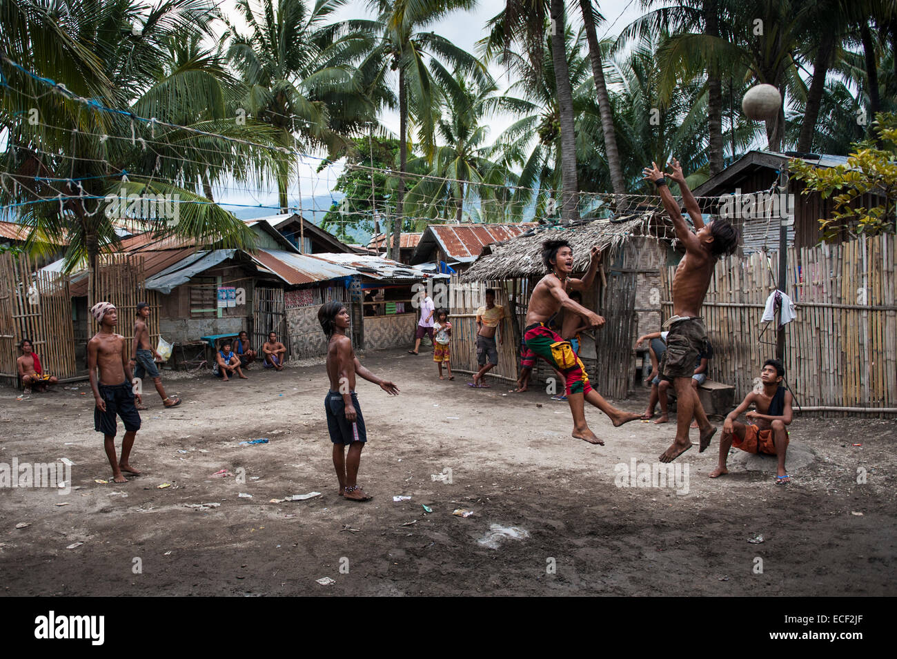 Badjao men playing volleyball Stock Photo