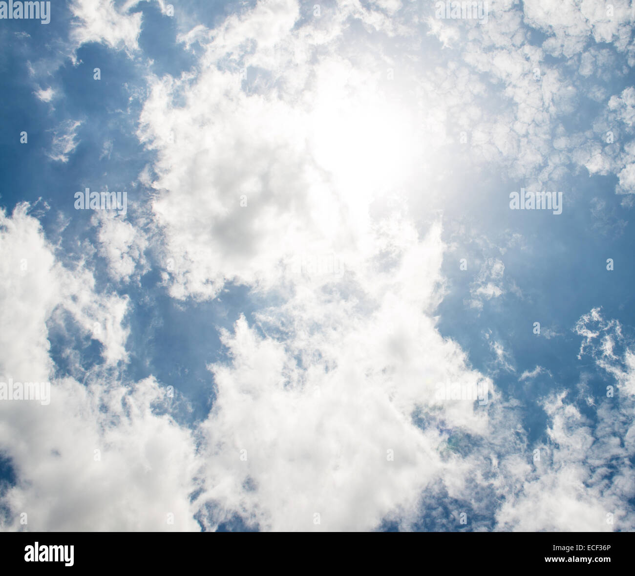 The blue sky and white fluffy clouds Stock Photo - Alamy