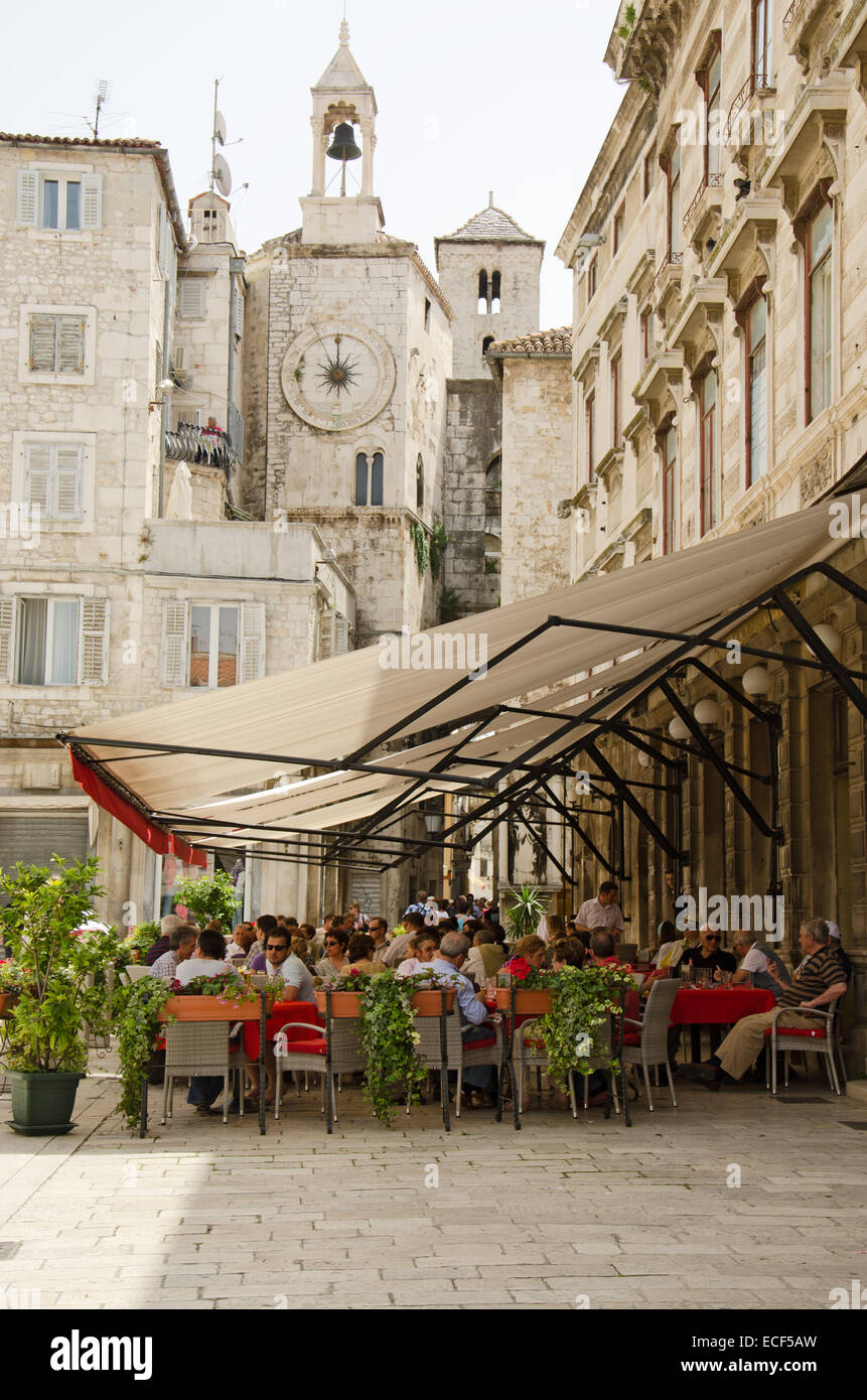 SPLIT, CROATIA - MAY 19, 2013: people are taking a brake in one of the street cafe in Split. On May 19, 2013, in Split, Croatia Stock Photo