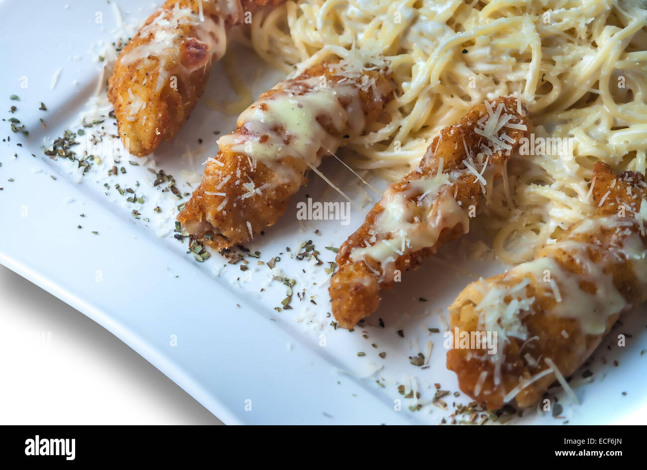 A plate of taquitos with French fries Stock Photo Alamy