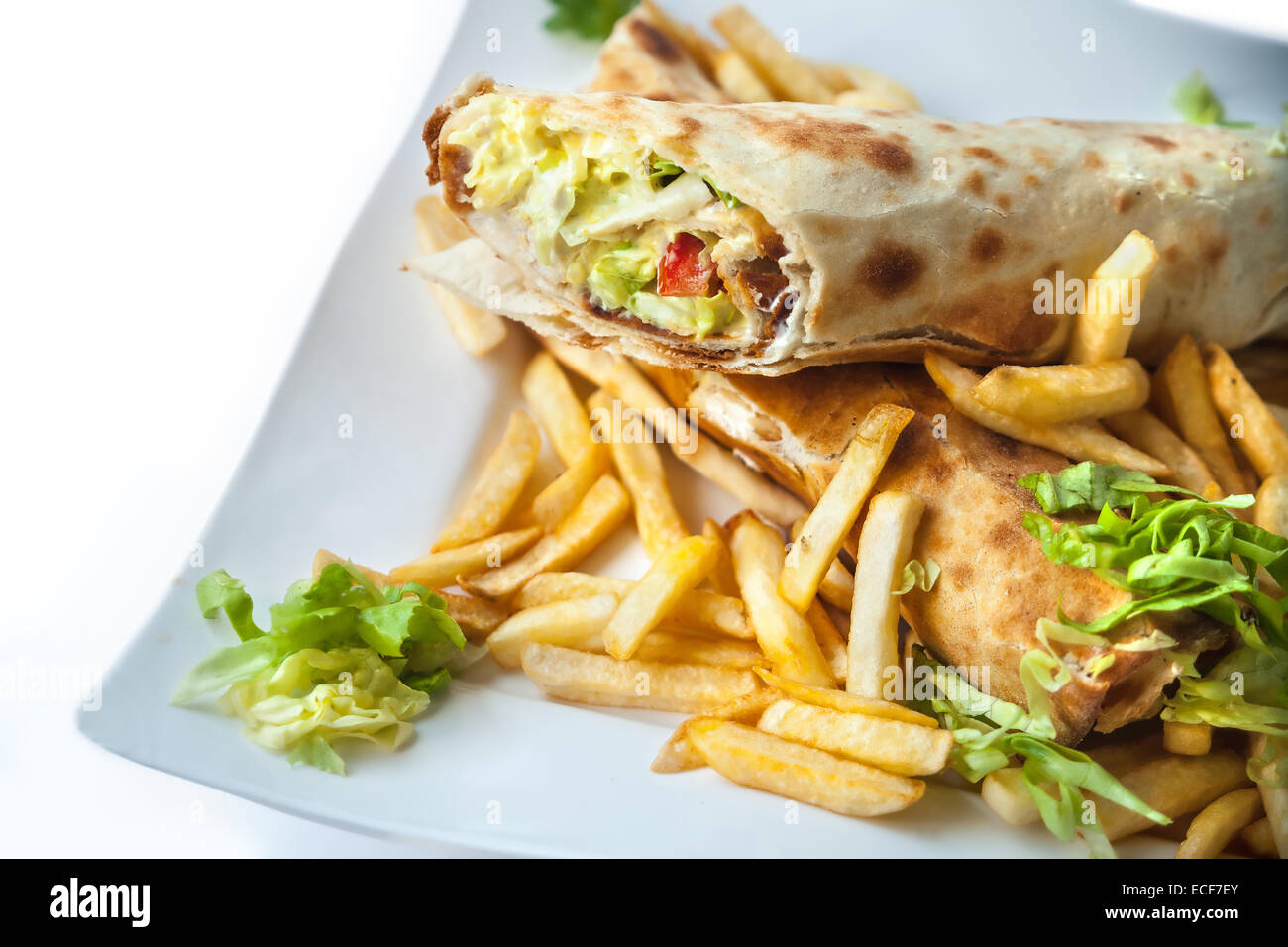 A plate of taquitos with French fries Stock Photo Alamy
