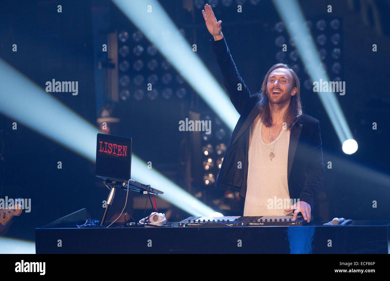 Berlin, Germany. 12th Dec, 2014. The French House DJ and music producer David Guetta stands on stage during the final of the TV show 'The Voice of Germany' in Berlin, Germany, 12 December 2014. The show is aired on the Sat.1 TV channel. Photo: Joerg Carstensen/dpa/Alamy Live News Stock Photo