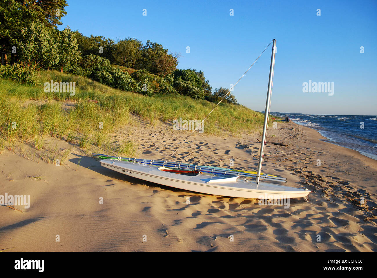 Sail boat on beach of Lake Michigan Stock Photo