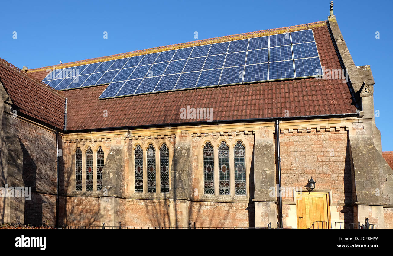 Solar panels on the roof of Cheddar Methodist Church, showing a green environmental awareness.  13th December 2014 Stock Photo