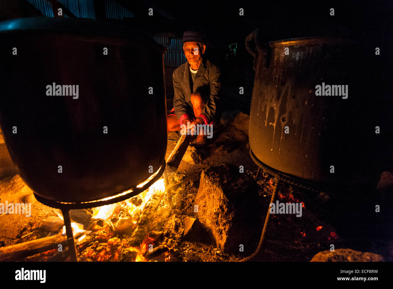 Cooking over an open fire for entire community Stock Photo