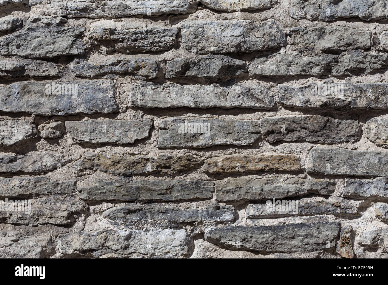 Photo of an old gray stone wall, background Stock Photo - Alamy