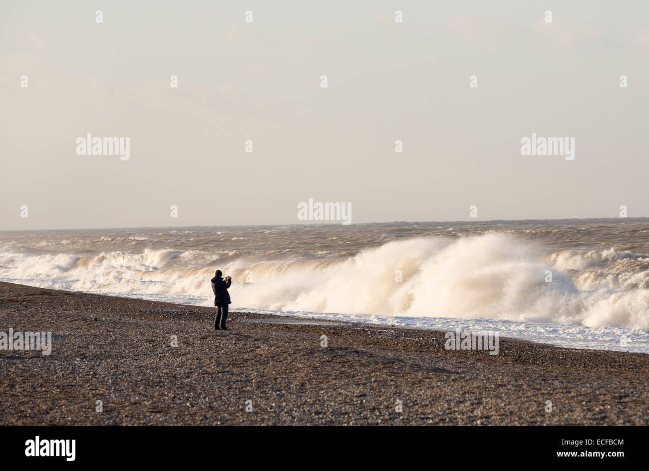 Storm waves crashing onto the shingle beach at Cley, Norfolk, UK. Stock Photo