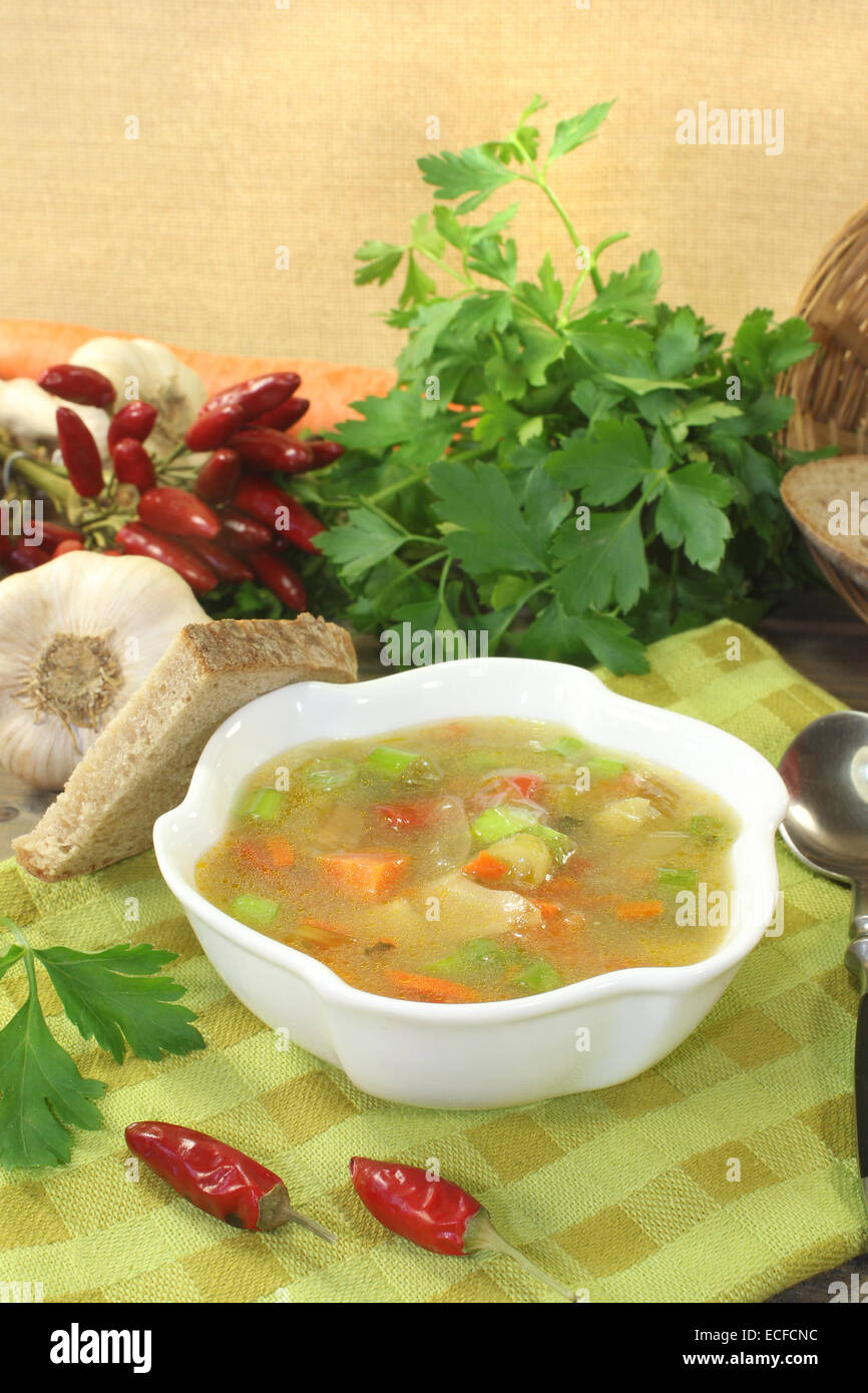 Poultry consomme with greens and smooth parsley Stock Photo Alamy