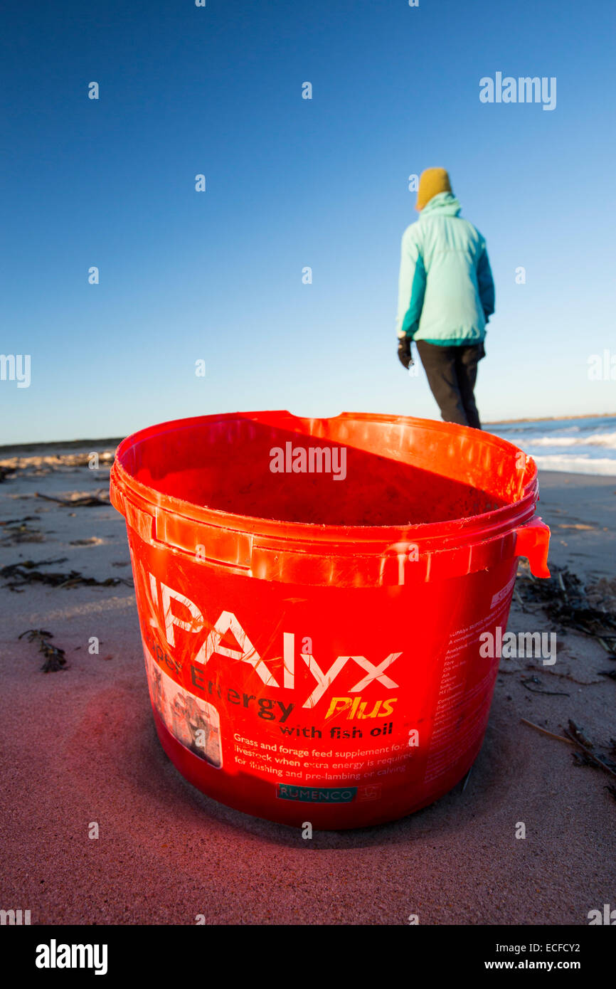 plastic rubbish on Beadnell beach, Northumberland, UK, at sunset. Stock Photo