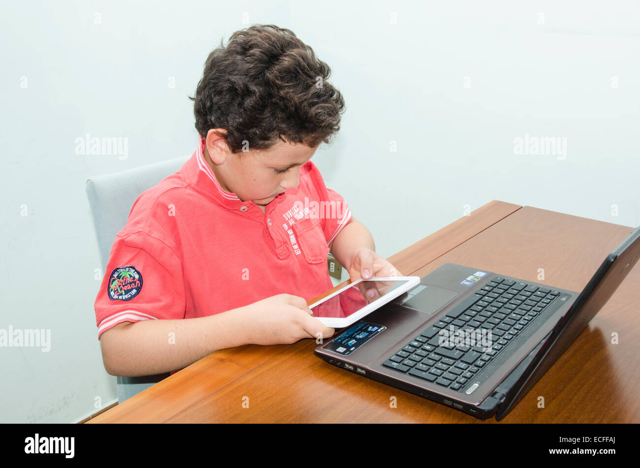 Study, play, learn, inquire with the new technologies. Stock Photo