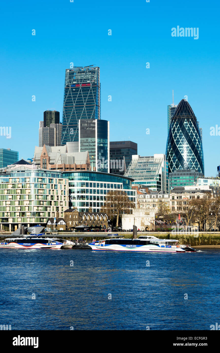 The Gherkin and Cheesegrater Skyscrapers in the City of London with Tower Millennium Ferry Pier England United Kingdom UK Stock Photo
