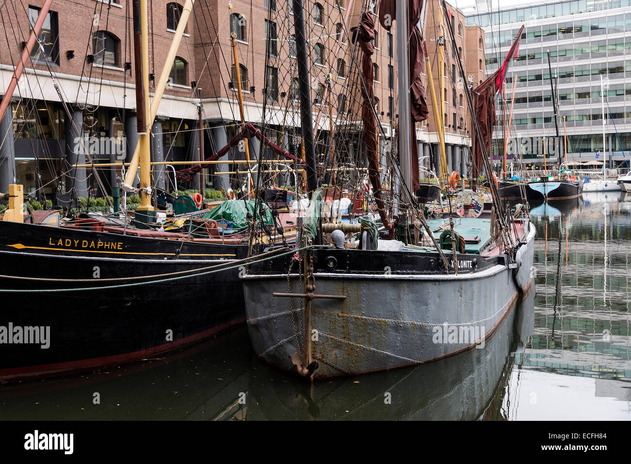Old Thames Barges and Boats Moored in the Marina at St Katharine Docks Tower Hamlets London England United Kingdom UK Stock Photo