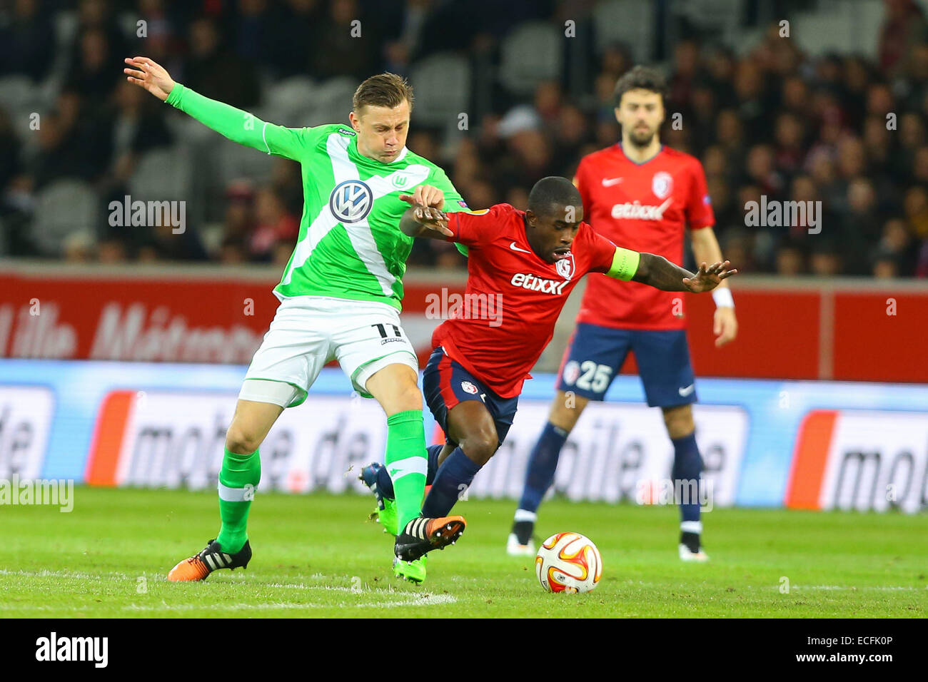 Lillel, France. 11th Dec, 2014. UEFA Europa League group stages. Lille versus Wolfsburg. Ivica Olic (Wolfsburg) and Antonio Rio Mavuba (Lille) © Action Plus Sports/Alamy Live News Stock Photo