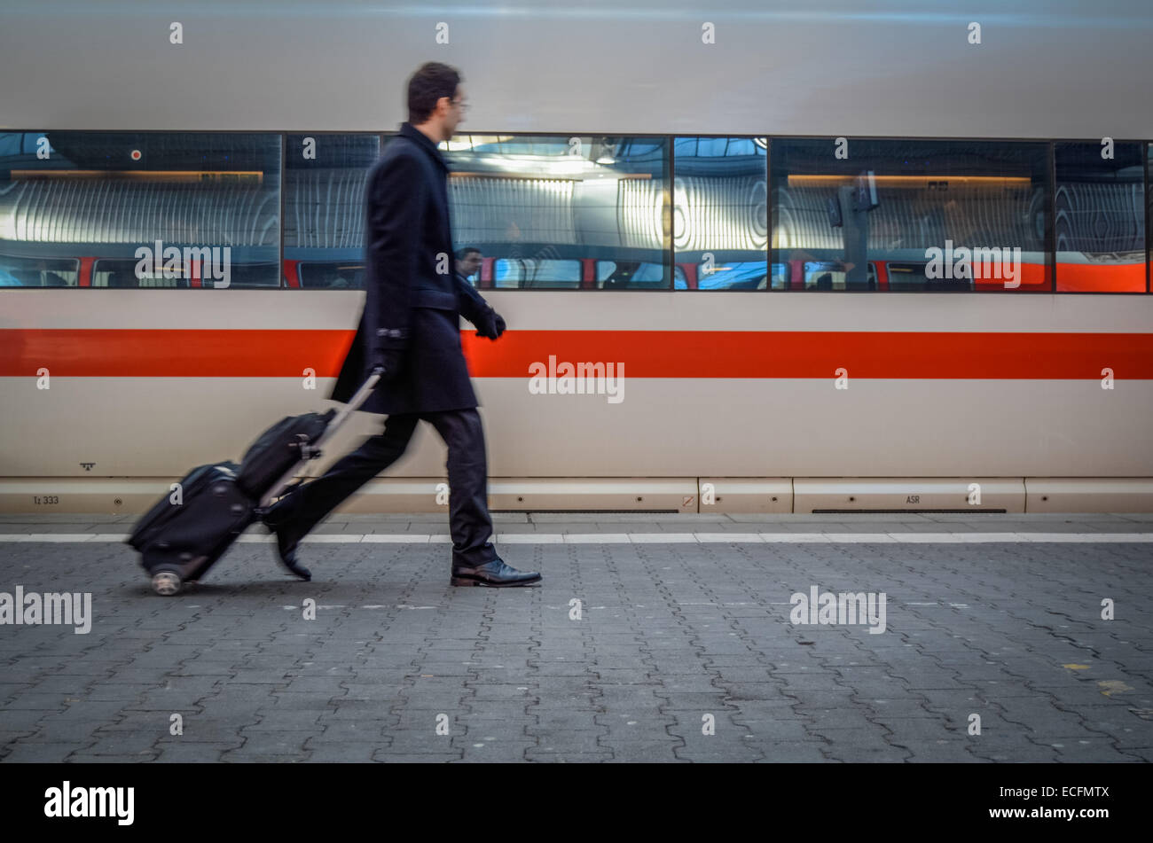 Man Rushing To Catch A Train Stock Photo