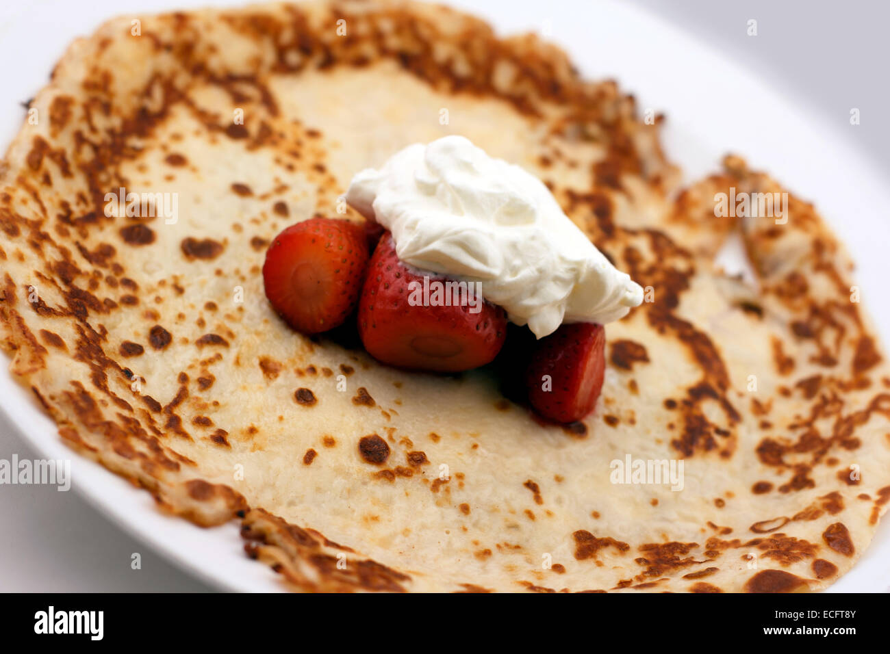 Pancake with whipped cream and strawberries Stock Photo - Alamy