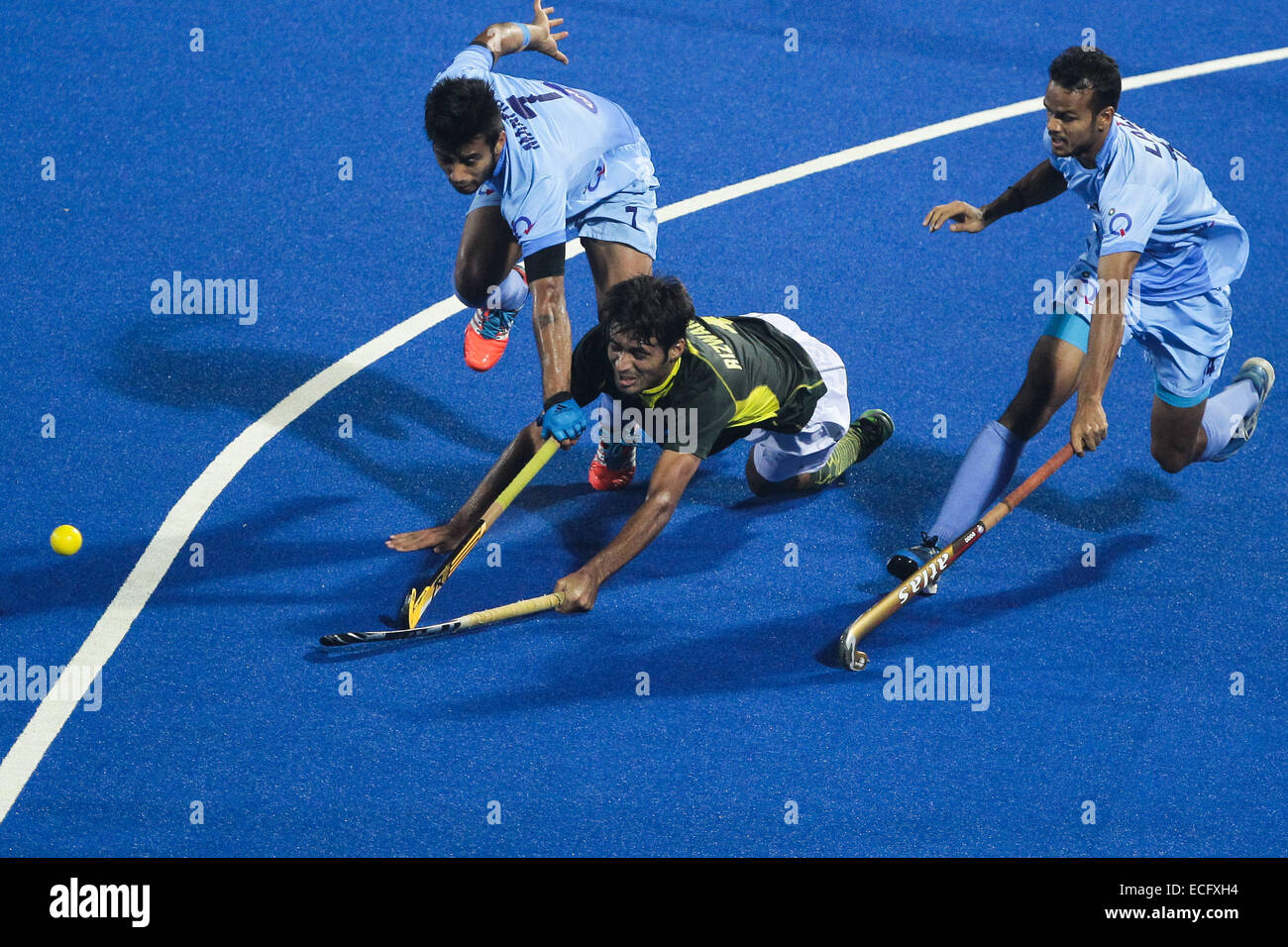 Bhubaneswar. 13th Dec, 2014. Muhammad Rizwan SR. of Pakistan (C) falls ...
