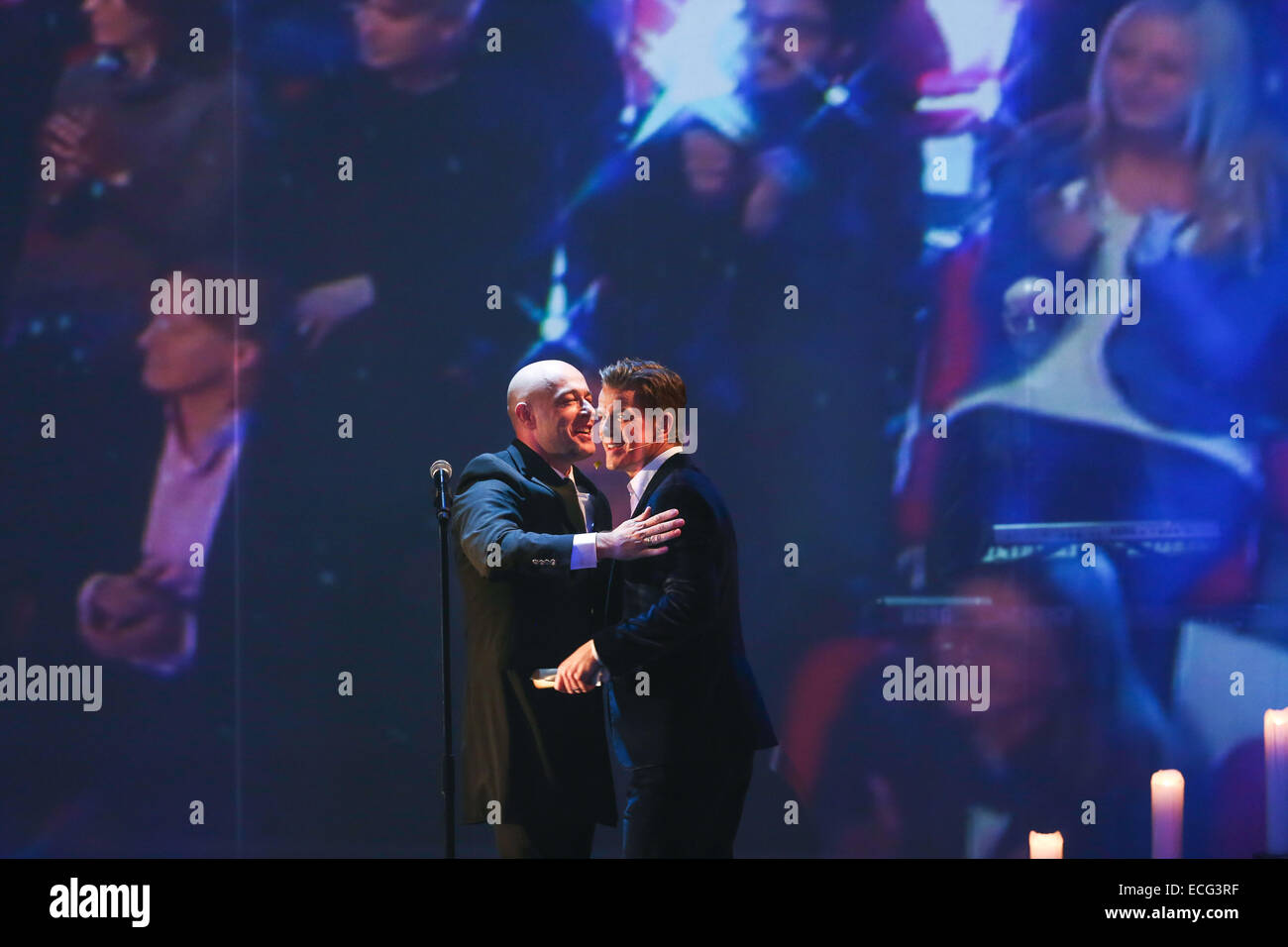 Nuremberg, Germany. 13th Dec, 2014. Presenter Markus Lanz (R) embraces the singer of the band 'Unheilig', 'Der Graf', on stage during the final edition of the German television game show 'Wetten, dass.?' (Wanna bet.?), aired on public broadaster ZDF, in Nuremberg, Germany, 13 December 2014. Germany's longtime television game show is now off air after 34 years. Photo: David Ebener/dpa/Alamy Live News Stock Photo