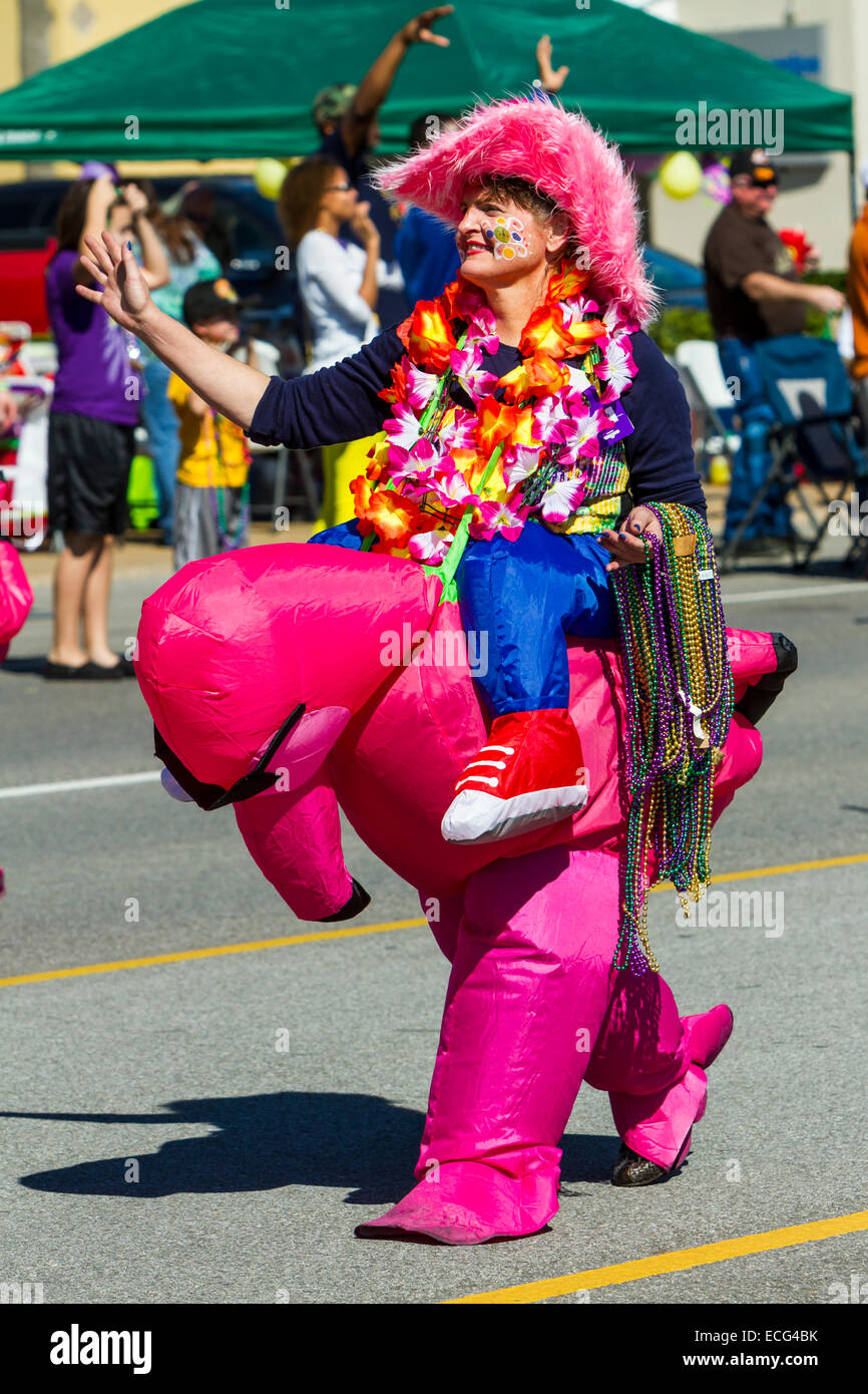 Mardi Gras celebrations and revelers in a parade on the streets of