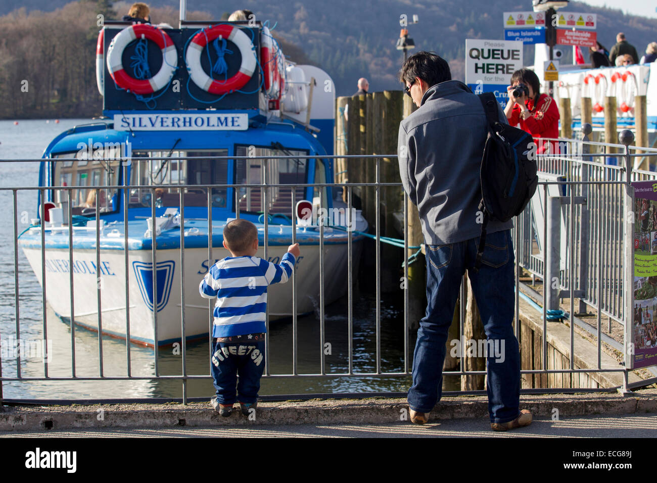 Weather Lake Windermere Cumbria UK Tourists make the most of the sunny
