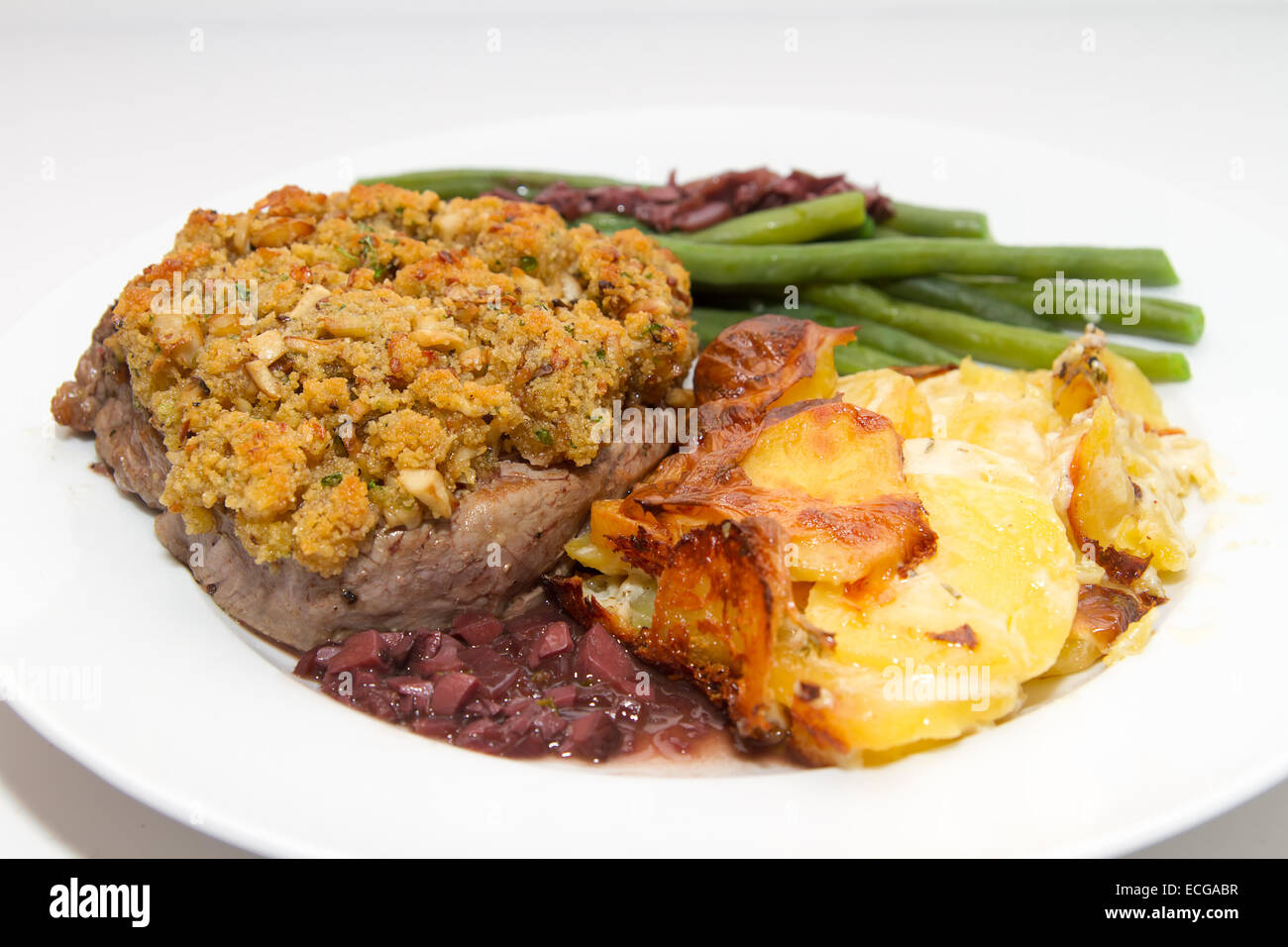 Beef fillet with porcini crust, potato and beans Stock Photo Alamy