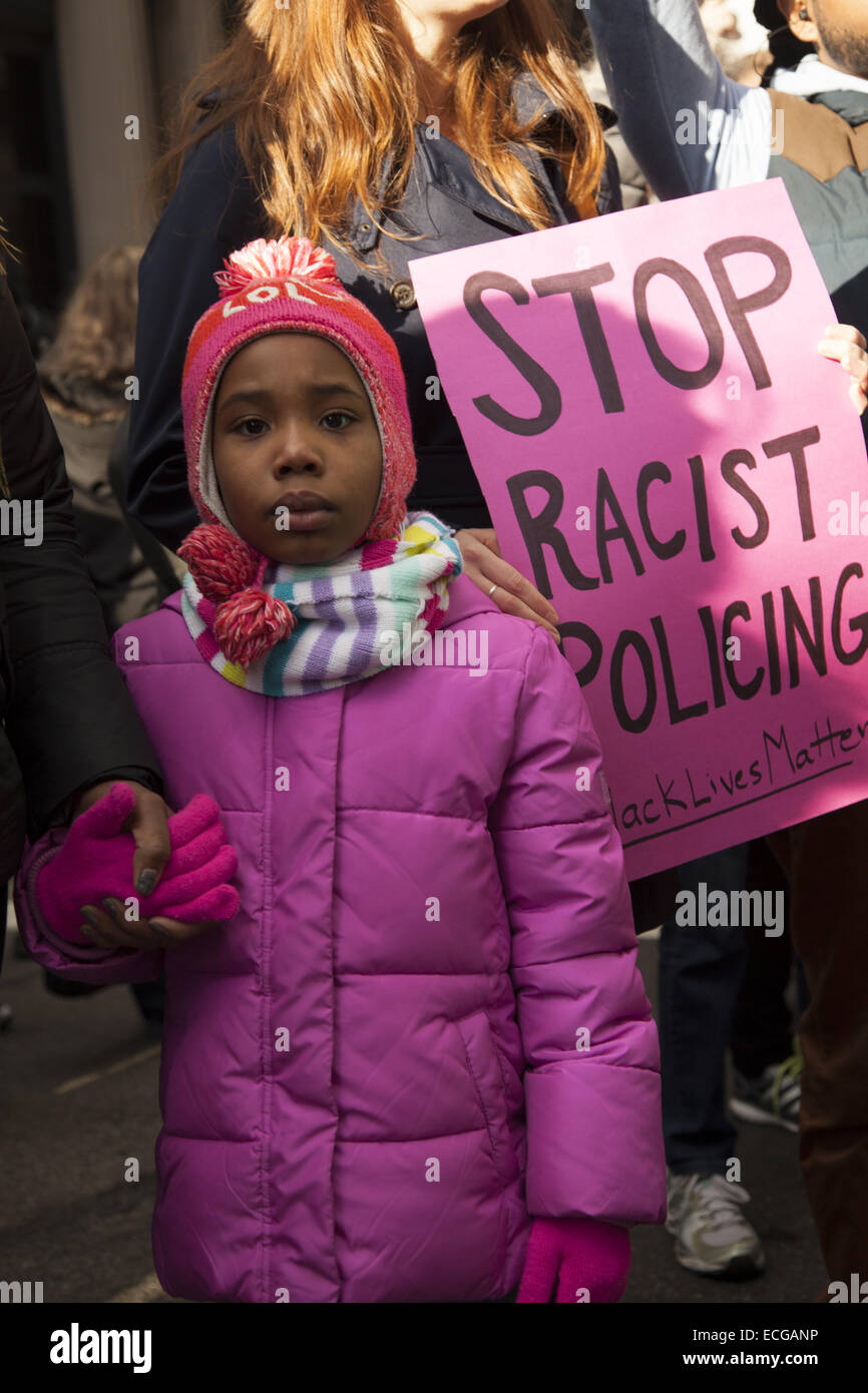 Sparked by the Grand Jury verdicts in Ferguson and the Eric Garner murder in NYC, thousands marched in NYC against police racial bias & the killings of unarmed black men all over the USA. Stock Photo