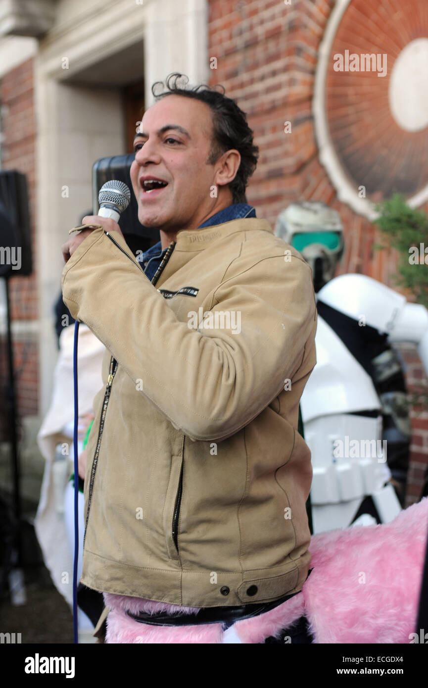 London, UK. 14th December, 2014. Dev Alahan from Coronation Street wears Katie Price (Jordan) pink pantomime horse. Greenwich Village annual sci-fi parade and pantomime horse race. Credit:  JOHNNY ARMSTEAD/Alamy Live News Stock Photo