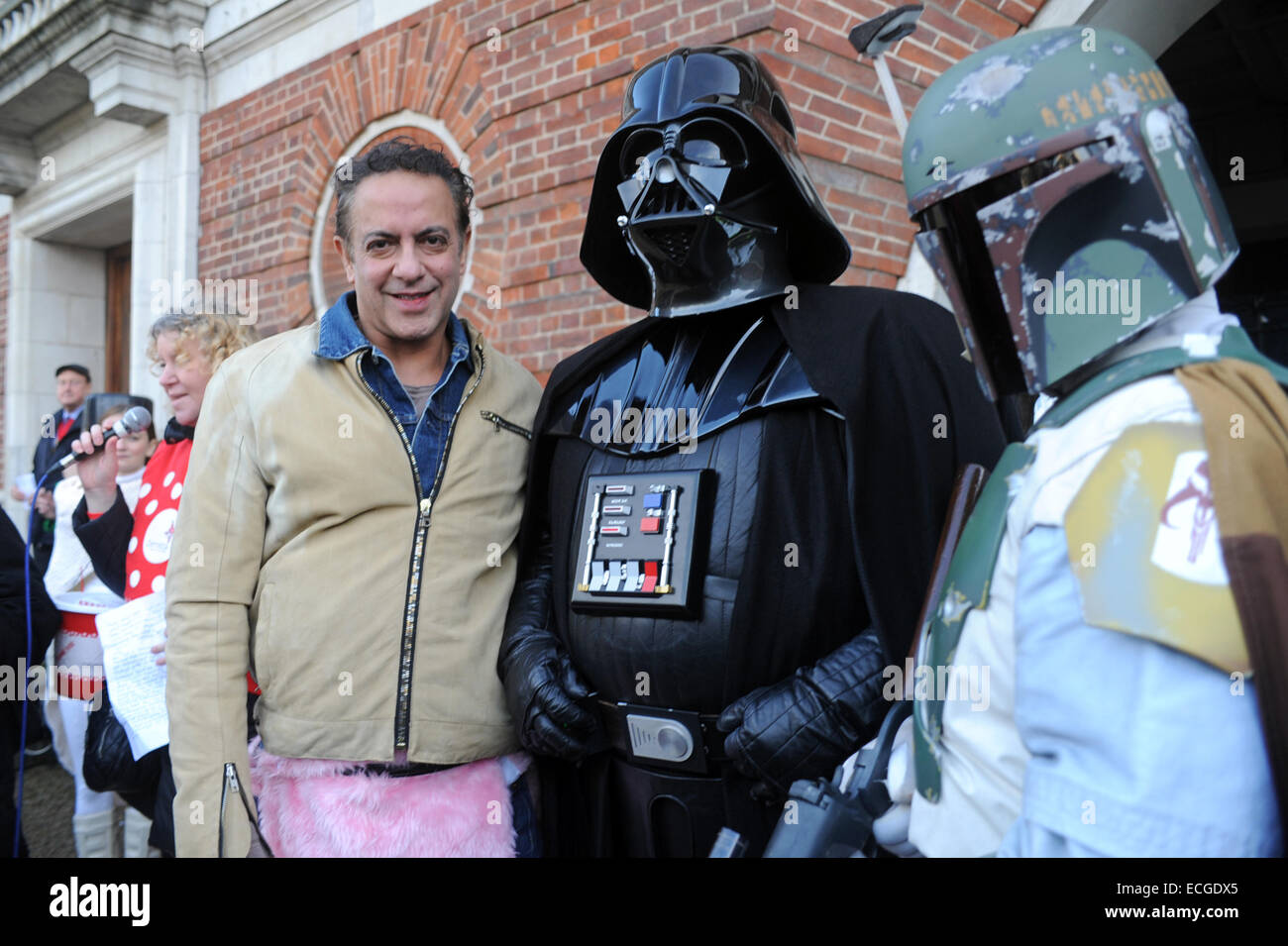 London, UK. 14th December, 2014. Dev Alahan from Coronation Street wears Katie Price (Jordan) pink pantomime horse with Darth Vader. Greenwich Village annual sci-fi parade and pantomime horse race. Credit:  JOHNNY ARMSTEAD/Alamy Live News Stock Photo