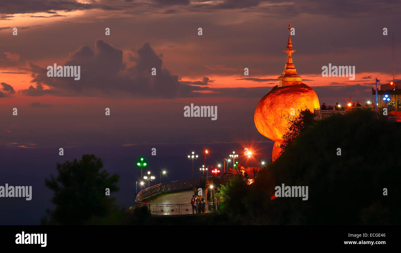 People praying and worship at Kyaikhtiyo pagoda on sunset, one of the most sacred sites in Kyaikhtiyo of Mon state in Myanmar. Stock Photo