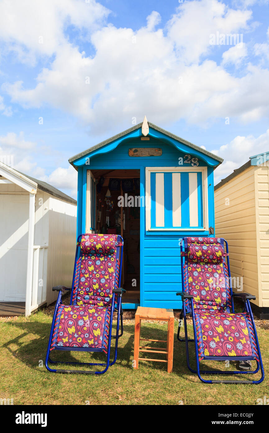 Beach hut with two reclining garden chairs, beach hut Stock Photo Alamy