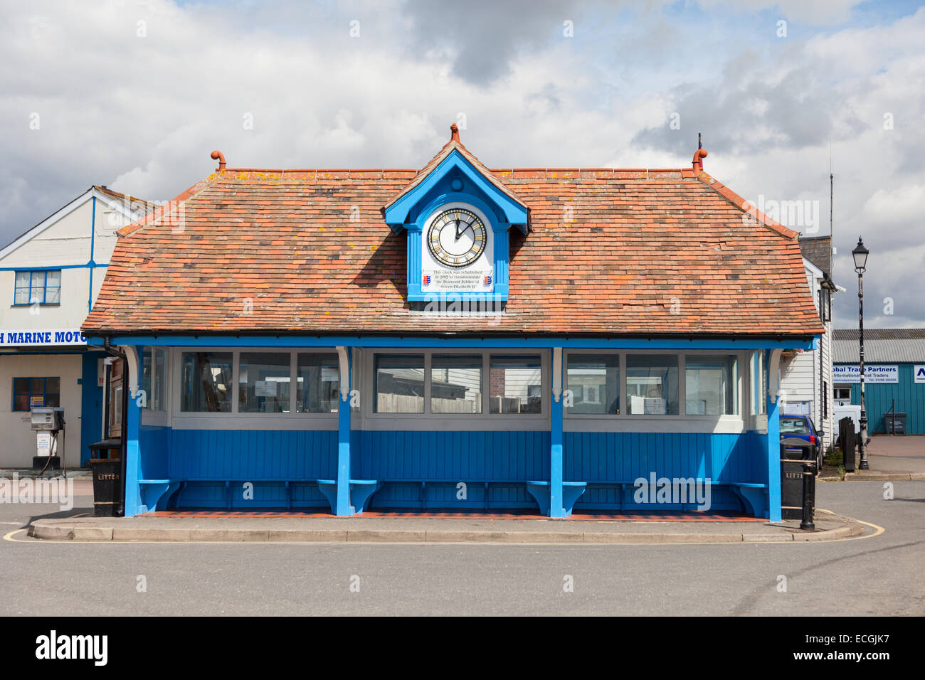 Brightlingsea bus stop near the seafront marina with a memorial clock in the roofline Stock Photo