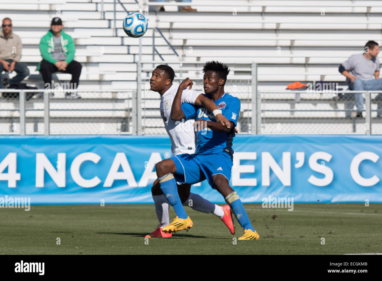 Cary, North Carolina, USA. 14th Dec, 2014. Virginia Cavaliers Defender KYLER SULLIVAN (13) and UCLA Bruins Forward LARRY NDJOCK (11) during the 2014 NCAA College Cup soccer championship match between Virginia and UCLA at WakeMed Soccer Park in Cary, NC. Virginia goes on to win 4 to 2 in PKs. © Jason Walle/ZUMA Wire/Alamy Live News Stock Photo
