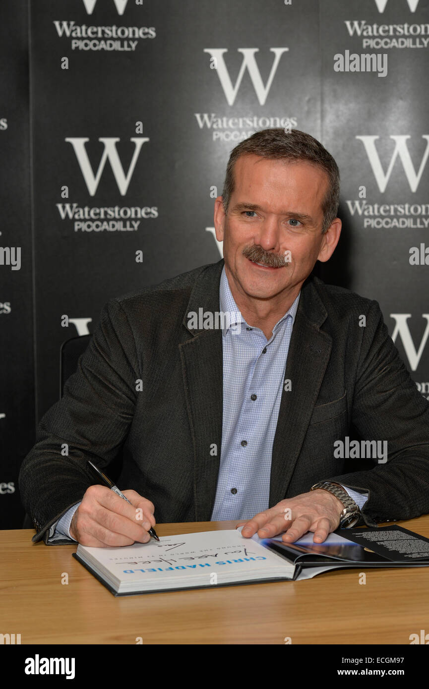 Canadian astronaut Chris Hadfield with his book, You Are Here, at Waterstone's, Piccadilly, London. Stock Photo