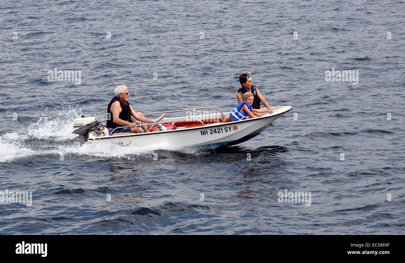 Boating sailing in a small Boston whaler on Lake Winnipesaukee New Hampshire USA America Stock Photo