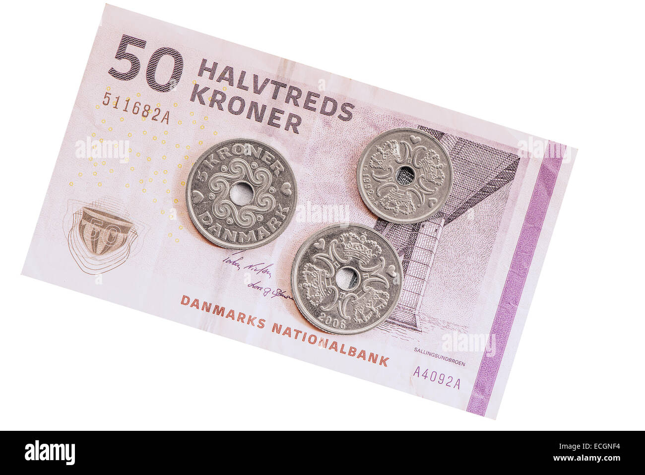 Danish coins on the fifty krones banknote background. Stock Photo
