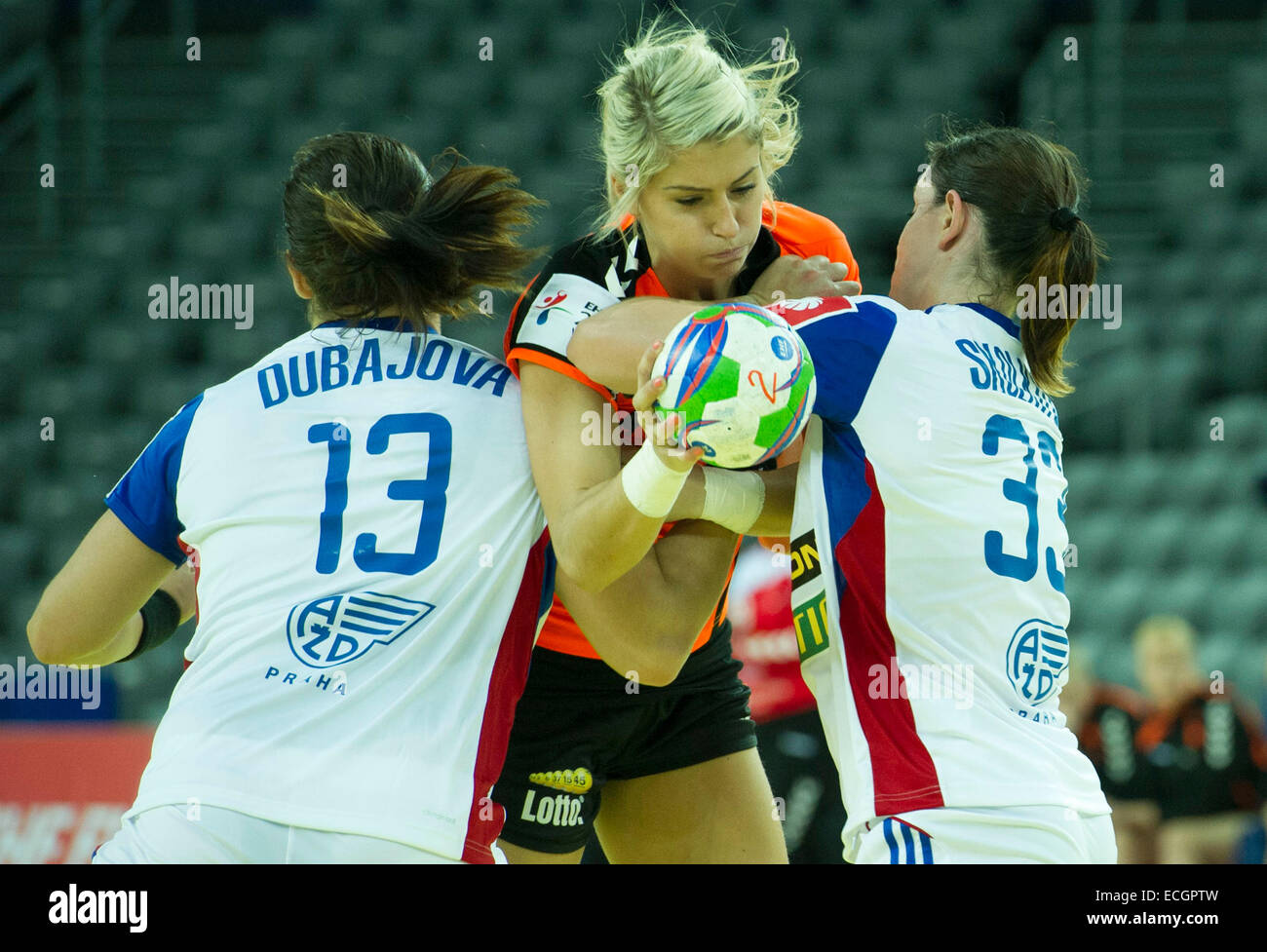 Zagreb, Croatia. 14th Dec, 2014. Estavana Polman (C) of the Netherlands is tackled by two players of Slovakia during the Women's EHF EURO 2014 handball match at the Arena Zagreb in Zagreb, Croatia, December 14, 2014. The Netherlands won 29-26. © Miso Lisanin/Xinhua/Alamy Live News Stock Photo