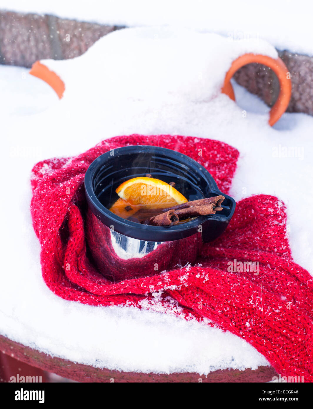 Cup of mulled wine on snow covered Stock Photo