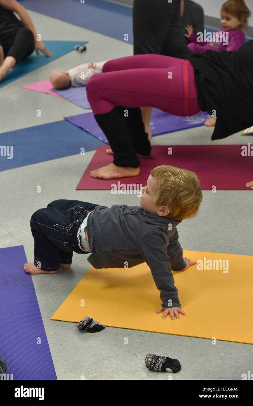 Infants doing yoga in daycare Stock Photo