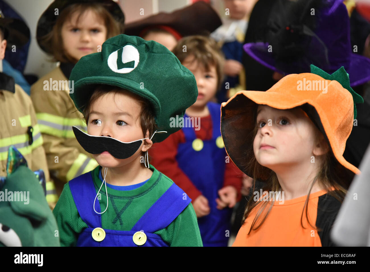 Infants at daycare all dressed in fancy dress for Hallowe'en Stock Photo