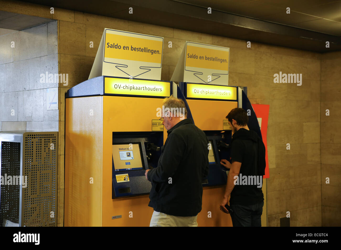 man-woman-buying-train-ticket-machine-amsterdam-central-station-stock