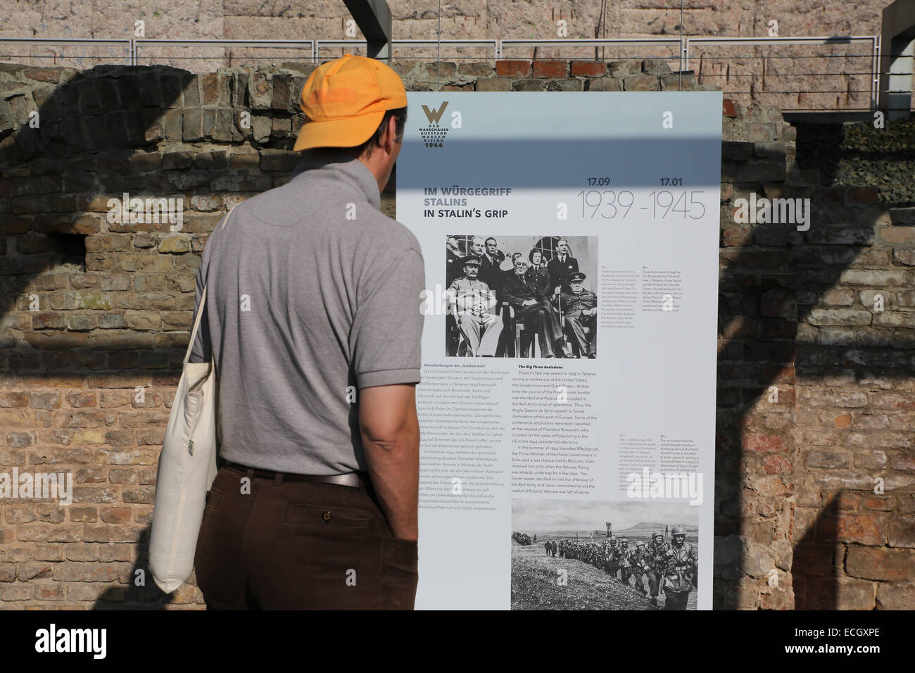 male tourist Topography of Terror man reading poster berlin germany Stock Photo