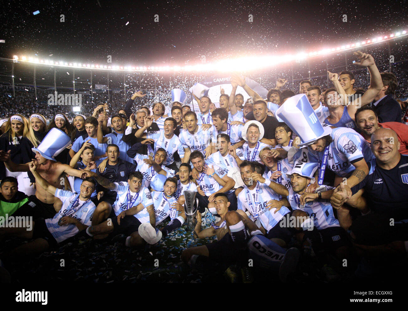 Avellaneda, Argentina. 14th Dec, 2014. Players of Racing Club celebrate with the trophy at the end of the Final match against Godoy Cruz of Argentinean Soccer First Division at Presidente Peron Stadium, in Avellaneda City, 20km from Buenos Aires City, Argentina, on Dec. 14, 2014. © Martin Zabala/Xinhua/Alamy Live News Stock Photo