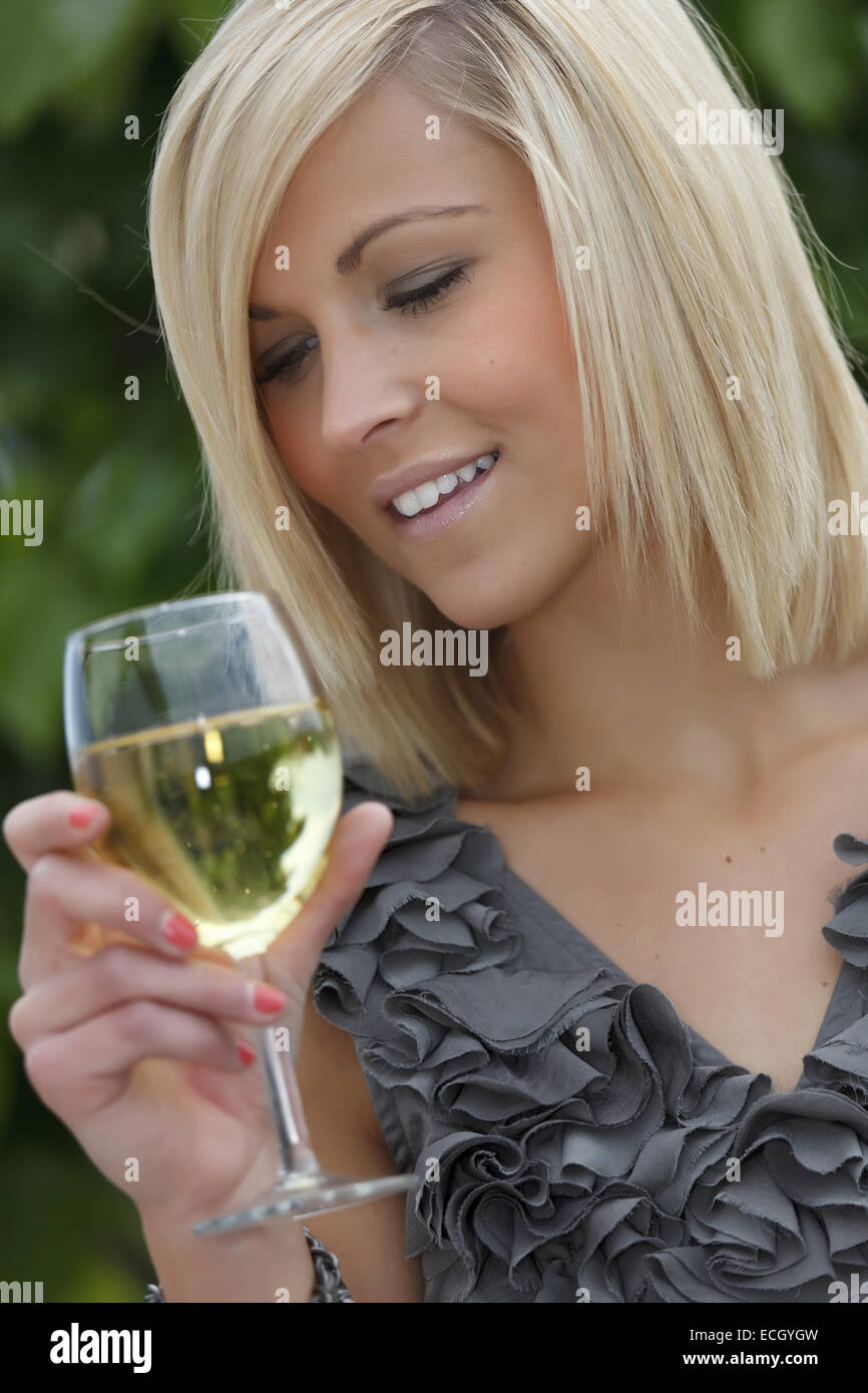 beautiful young woman with glass of wine Stock Photo - Alamy