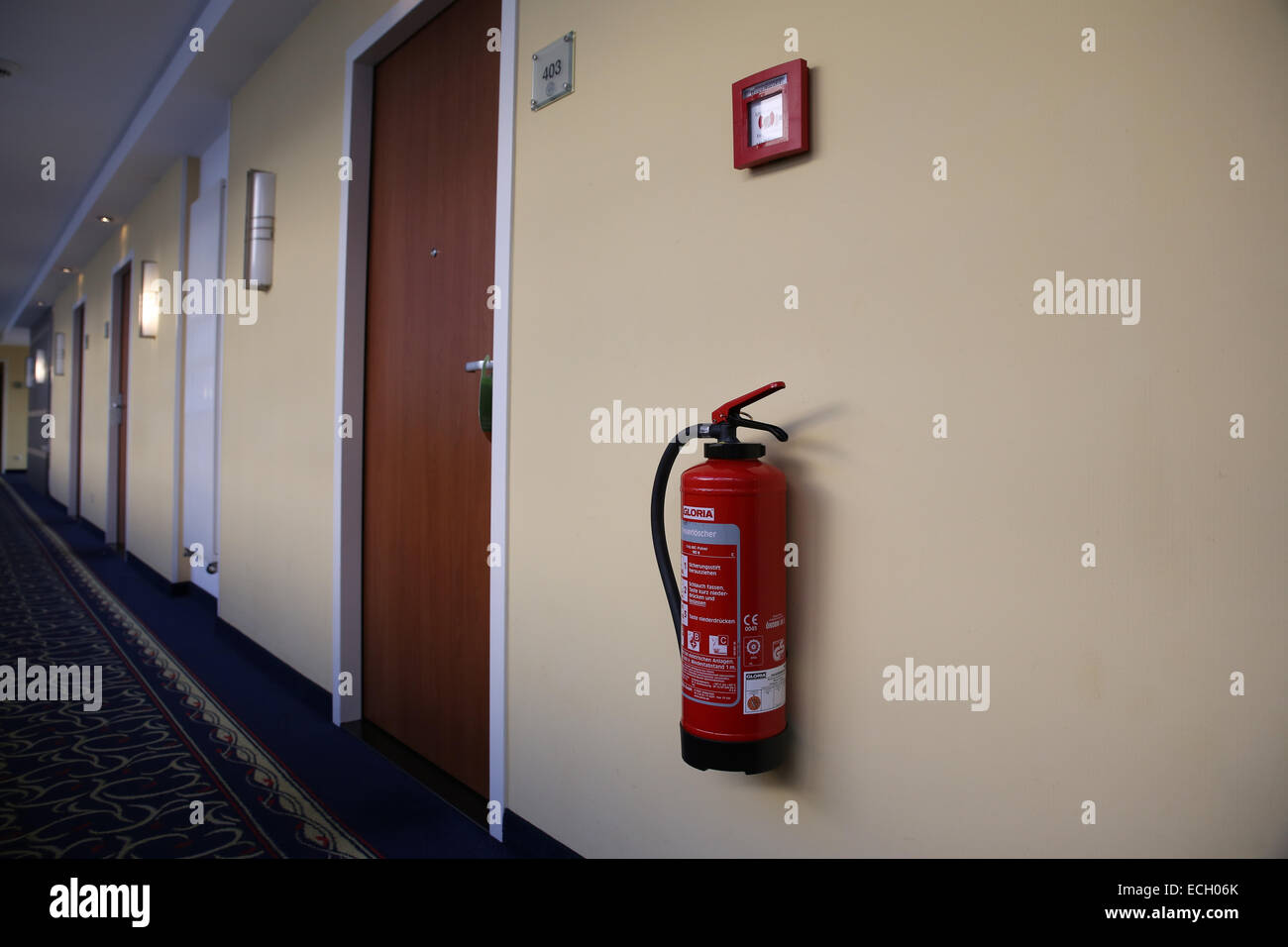 hotel hallway fire extinguisher Stock Photo Alamy