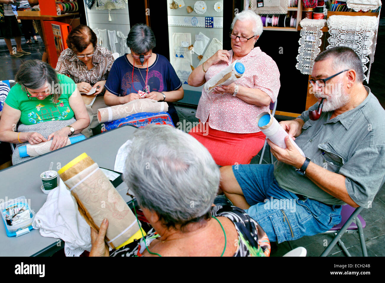 Elderly people busy with embroidery, Plaza Redonda, Round Square, el clot, the hole, Valencia, Spain Stock Photo