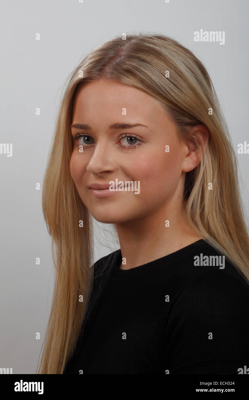 headshot or portrait of a young blonde woman with green eyes, wearing a  black top Stock Photo - Alamy
