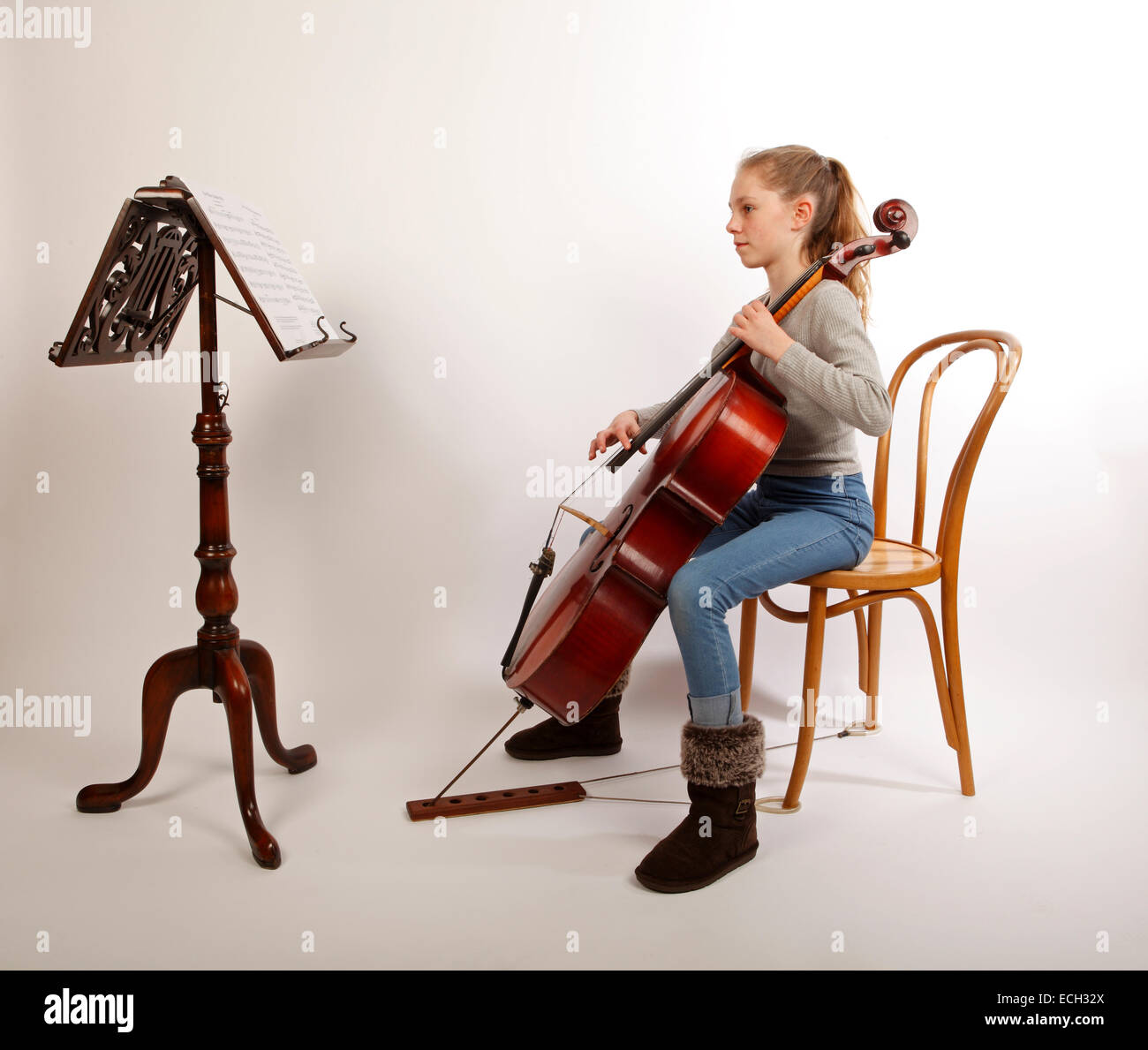young girl playing the cello, pizzicato, plucking, plucked. Stock Photo