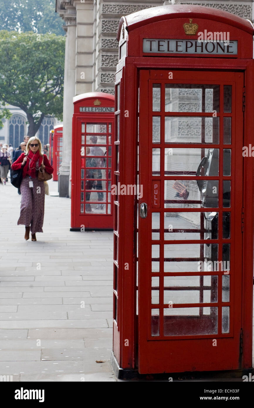 Three Red Telephone Box on the streets of London England Stock Photo