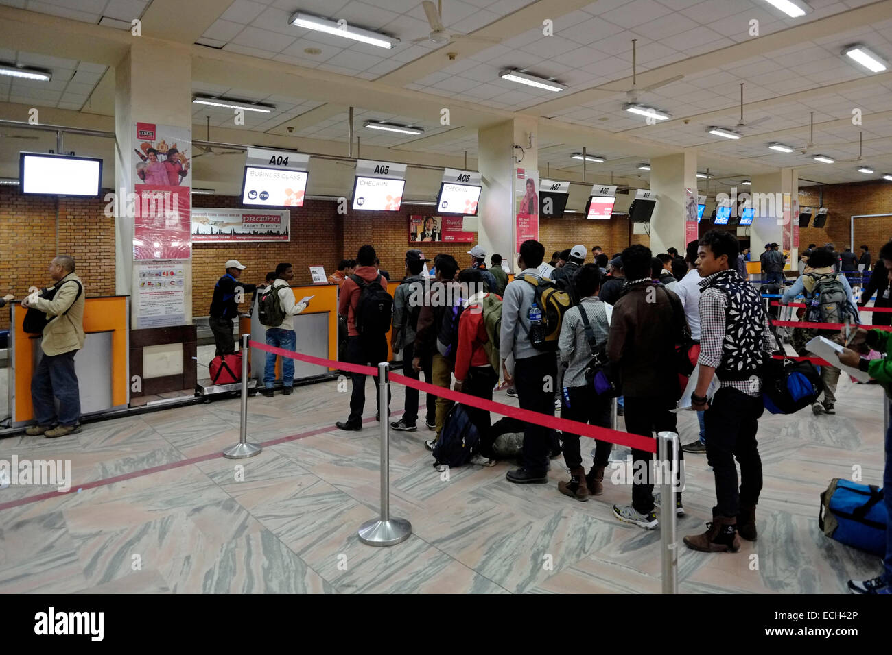 Passengers wait in line at checkin counters in Tribhuvan International airport in Kathmandu Passengers wait in line at checkin counters in Tribhuvan International airport in Kathmandu