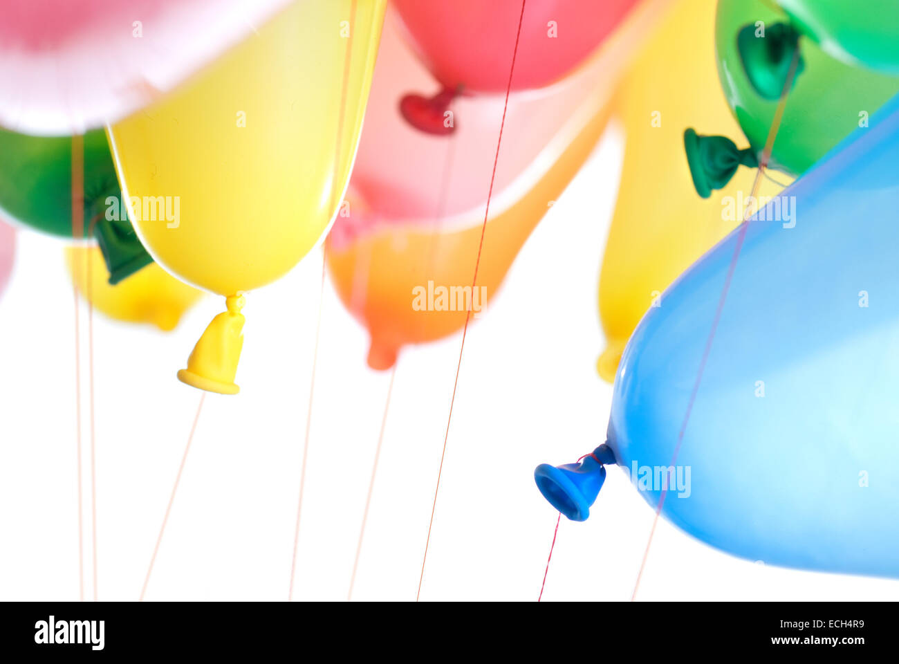 color balloons isolated on white Stock Photo - Alamy