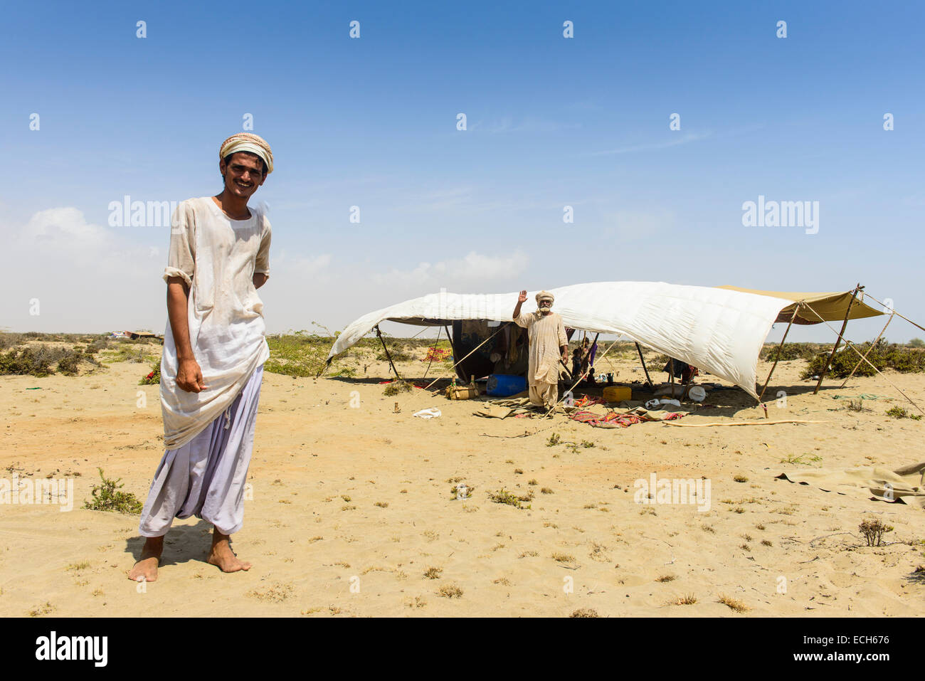 Rashaida man standing in front of his tent in the desert around Massaua, Eritrea Stock Photo